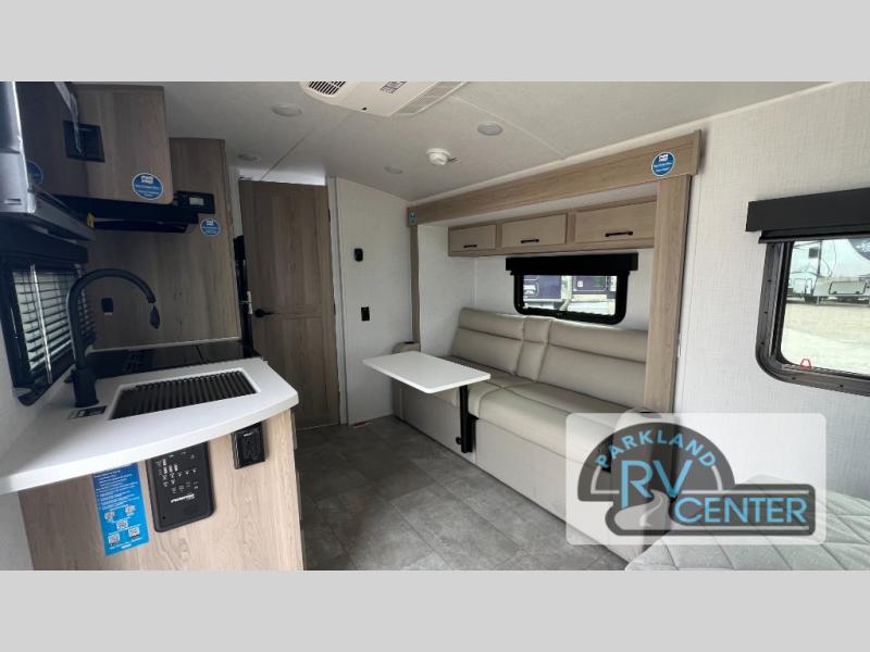 Forest River RV Rockwood GEO Pro G20FBS travel trailer interior with a slide out with a sofa and a removable table